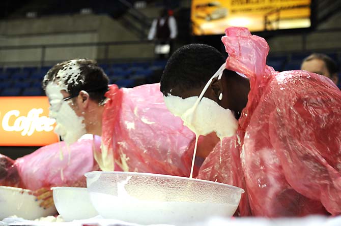 A contestant's face drips with ranch dressing during a bobbing for wings competition Saturday, April 26, 2014 during the first annual Louisiana Wing-a-thon at the Baton Rouge River Center.