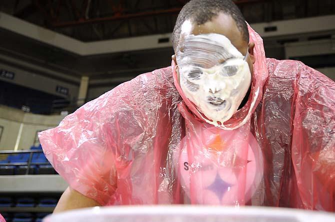 A contestant's face drips with ranch dressing during a bobbing for wings competition Saturday, April 26, 2014 during the first annual Louisiana Wing-a-thon at the Baton Rouge River Center.