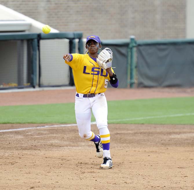 LSU freshman infielder Constance Quinn (5) throws toward first base Sunday, April 6, 2014, during the Tigers' 9-0 win against Tennessee in Tiger Park.