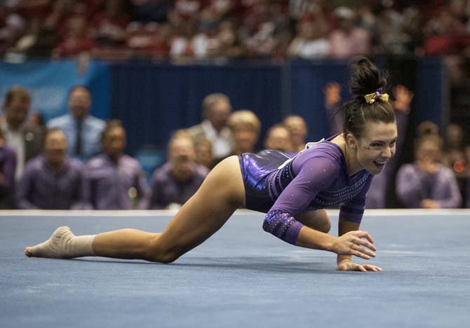 LSU junior all-around gymnast Rheagan Courville crawls during her floor routine Saturday, April 19, 2014 in the fourth rotation of the NCAA Super Six Finals in Birmingham, Ala.