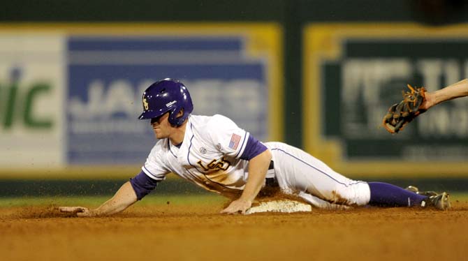 LSU senior outfielder Sean McMullen (7) slides safely into second Friday, April 25, 2014 during the Tigers' 8-7 victory against Tennessee at Alex Box Stadium.