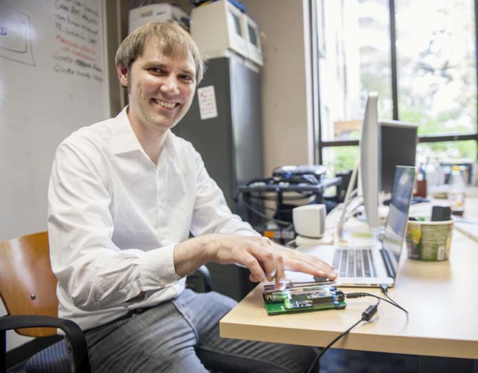 LSU Assistant Professor of Experimental Music and Digital Media Edgar Berdahl demonstrates his unique musical instrument Tuesday, April 1, 2014, called the FireFader.