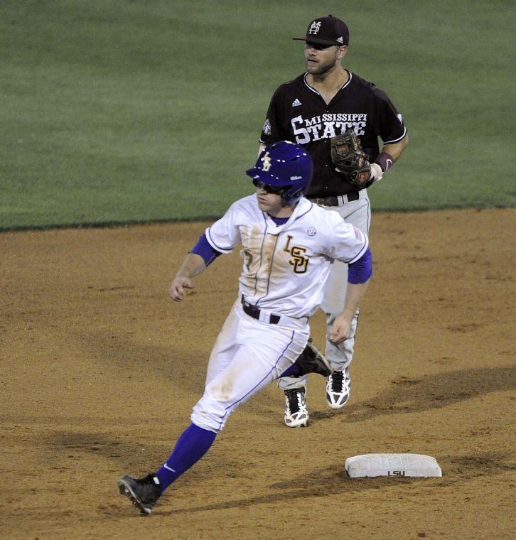 LSU senior outfielder Sean McMullen (7) runs past second base during the Tigers' 3-0 victory against Mississippi State on Friday, April 4, 2014 at Alex Box Stadium.