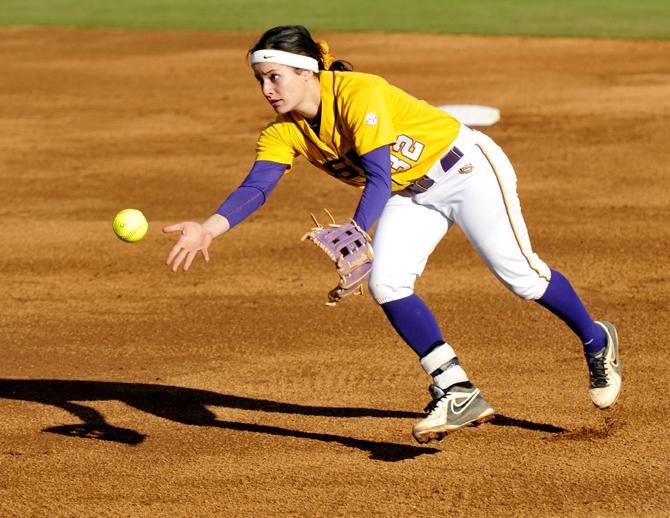 LSU junior second baseman Allison Falcon tosses Sunday, Feb. 17, 2013 to first for an out during the 1-0 victory over Nicholls State at Tiger Park.