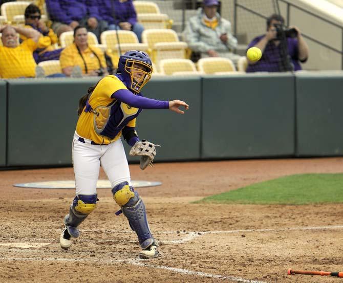 LSU sophomore catcher Kelsi Kloss (77) throws toward first base Sunday, April 6, 2014, during the Tigers' 9-0 loss to Tennessee in Tiger Park.