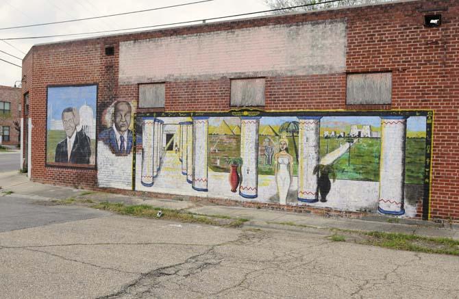 A mural covers the wall of an abandoned building on Thomas Delpit Drive in Old South Baton Rouge.