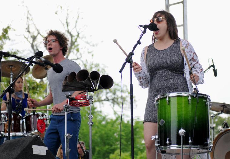 Sam Craft and Alexis Marceaux of Sweet Crude sing to the crowd Saturday, April 26, 2014 at the annual Festival International de Louisiane in Downtown Lafayette.