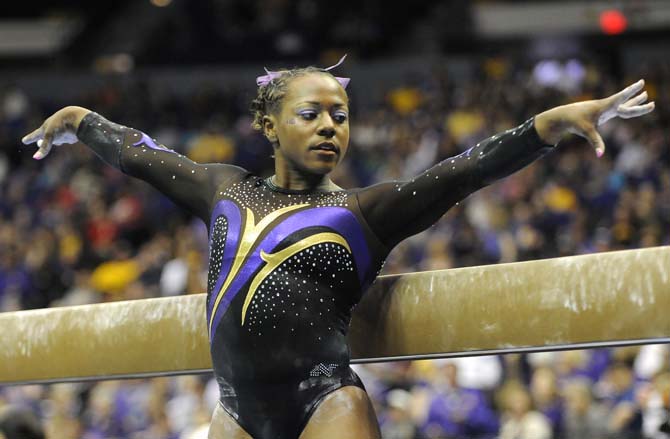 LSU junior all-around gymnast Lloimincia Hall poses during her beam routine Saturday, April 5, 2014 at the NCAA Gymnastics Regional in the PMAC. LSU won the regional with a score of 198.325.