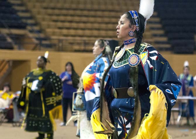 Traci Ashapanek and other dance participants compete Saturday, April 5, 2014 during the 5th Annual LSU Native American Student Organization Spring Pow Wow held in Parker Coliseum.