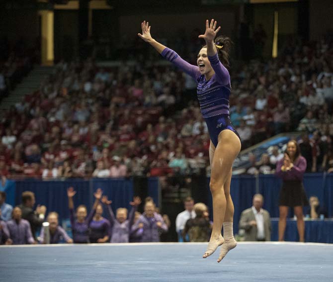 LSU junior all-around gymnast Rheagan Courville celebrates after her floor routine Saturday, April 19, 2014 during the fourth rotation of the NCAA Super Six Finals in Birmingham, Ala.