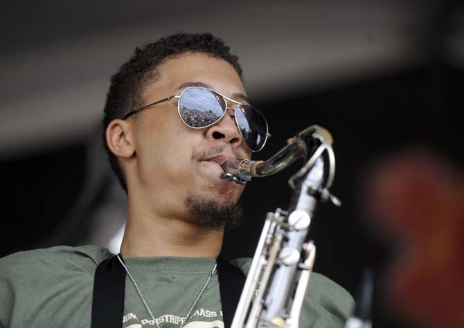 A member of the Young Pinstripe Brass Band performs Sunday, April 27, 2014, during the New Orleans Jazz and Heratige Festival.