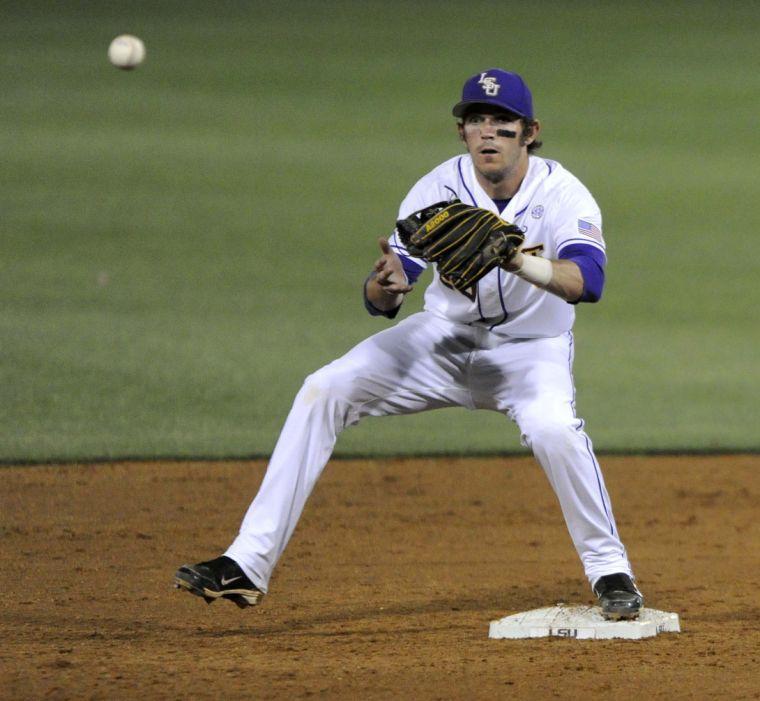 LSU junior infielder Conner Hale (20) catches the ball at second base during the Tigers' 3-0 victory against Mississippi State on Friday, April 4, 2014 at Alex Box Stadium.