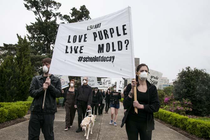 LSU School of Art &amp; Design students and supporters hold up signs in protest of the poor conditions in the Studio Arts Building on Tuesday, April 8, 2014, in front of the Louisiana State Capitol.