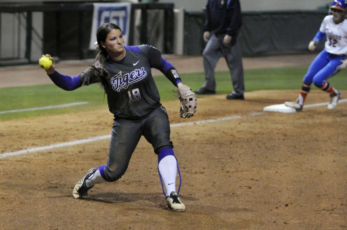 LSU senior infielder Tammy Wray (18) throws the ball during the Lady Tigers' 3-2 victory against the Gators on March 15, 2014 at Tiger Park.