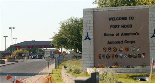 FILE - In this Thursday, Nov. 5, 2009, file photo, an entrance is shown to Fort Hood Army Base in Fort Hood, Texas. Fort Hood says there's been a shooting at the Texas Army base and that there have been injuries, on Wednesday, April 2, 2014. (AP Photo/Jack Plunkett)