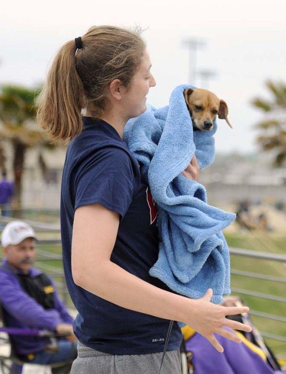 LSU senior forward Theresa Plaisance holds her dog Sunday, April 6, 2014, at Tiger Park.