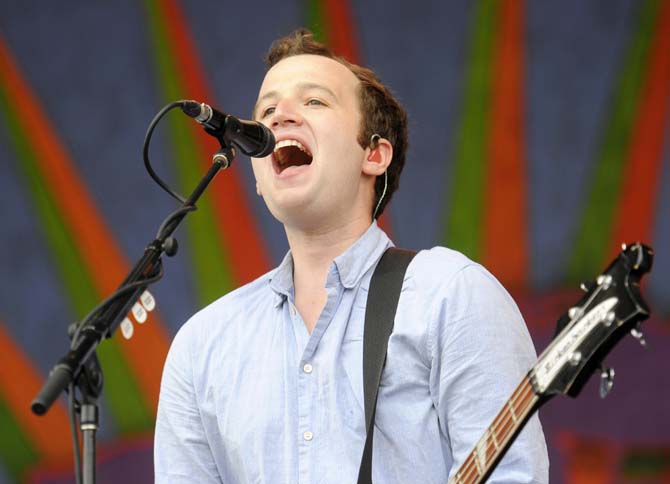 Vampire Weekend bassist Chris Baio sings into the microphone Sunday, April 27, 2014, during the New Orleans Jazz and Heritage Festival.