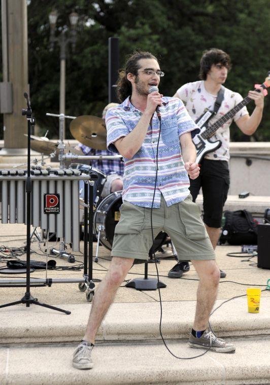 Austin Guidry, member of The SSDP Funk Squad, sings to the crowd Thursday, April 24, 2014 during Spring Greening on the LSU Parade Grounds.