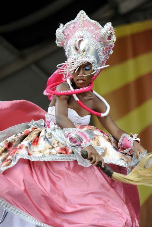 Brazillian group Afoxe Omo Nile Ogunja performs Saturday, April 26, 2014, during the New Orleans Jazz and Heratige festival in New Orleans.