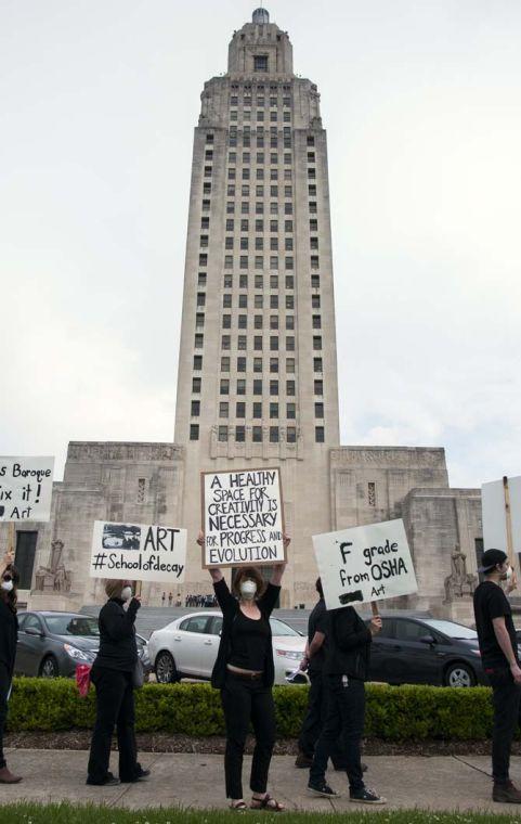 LSU School of Art &amp; Design students and supporters hold up signs in protest of the poor conditions in the Studio Arts Building on Tuesday, April 8, 2014, in front of the Louisiana State Capitol.