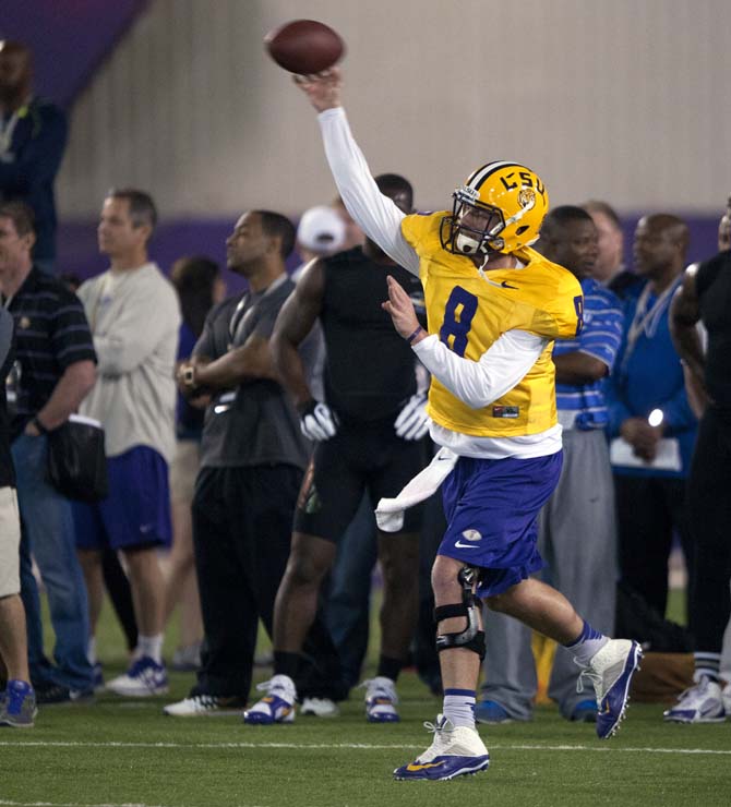 LSU senior quarterback Zach Mettenberger (8) throws a pass during LSU Pro Day on Wednesday, April 9, 2014 in the LSU Indoor Practice Facility.