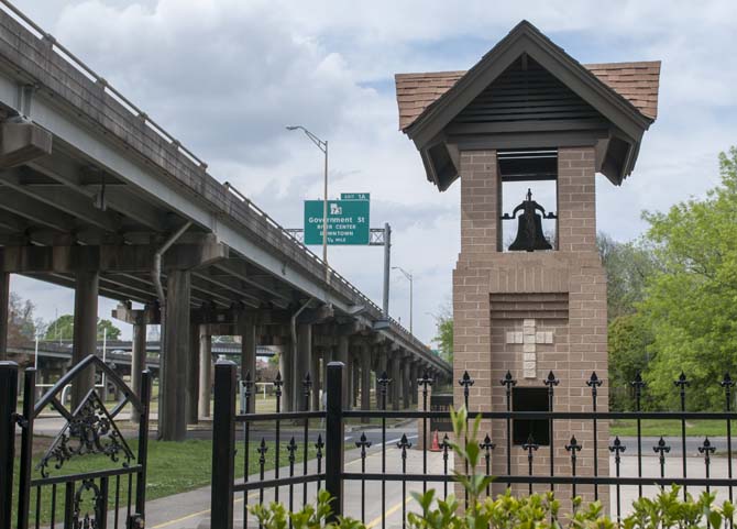 St. Francis Xavier Catholic Church sits in the literal shadow of I-10, the construction of which forced the newly-built St. Francis Xavier High School to be bulldozed.