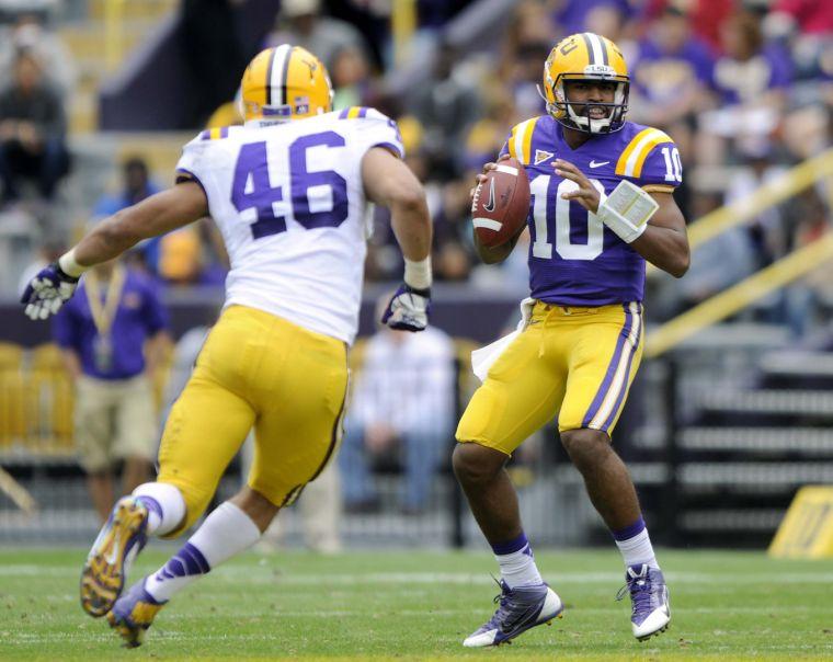 LSU sophomore quarterback Anthony Jennings (10) seeks to pass the ball Saturday, April 5, 2014 during the white squad's 42-14 victory against the purple squad in the National L Club Spring Game in Tiger Stadium.