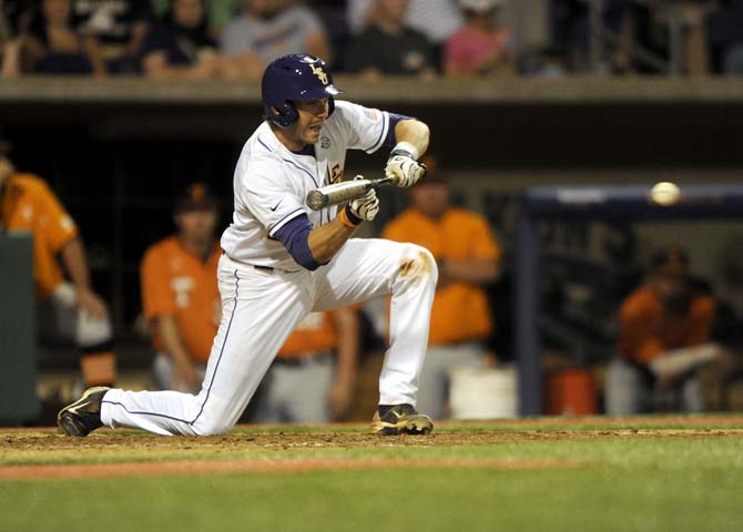 LSU junior infielder Connor Hale attempts a bunt on Friday, April 25, 2014 during the Tigers' 8-7 victory against Tennessee at Alex Box Stadium.