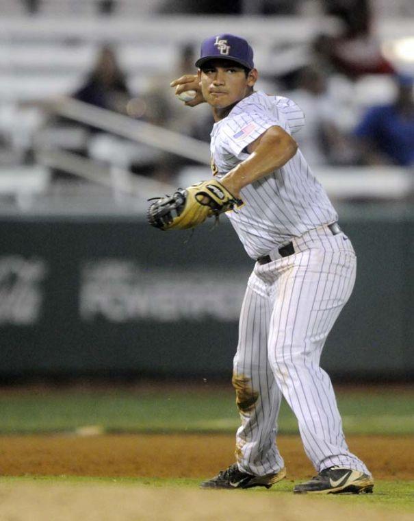 LSU senior infielder Christian Ibarra (14) throws the ball to first base Tuesday, April 29, 2014, during the Tigers' 9-7 victory against Alcorn in Alex Box Stadium.