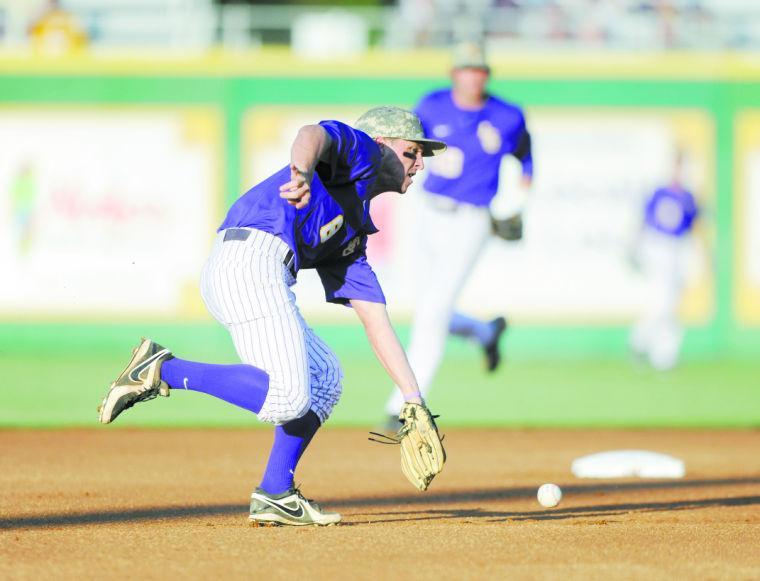 LSU sophomore infielder Alex Bregman (8) fields a ground ball Tuesday, April 22, 2014, during the Tigers' 6-0 win against Tulane in Alex Box Stadium.