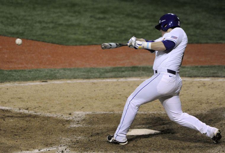 LSU junior catcher Cade Scivicque (22) slams the ball during the Tigers' 3-0 victory against Mississippi State on Friday, April 4, 2014 at Alex Box Stadium.