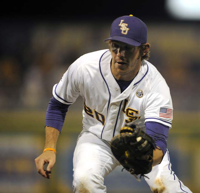 LSU junior infielder Connor Hale fields a grounder on Friday, April 25, 2014 during the Tigers' 8-7 victory against Tennessee at Alex Box Stadium.