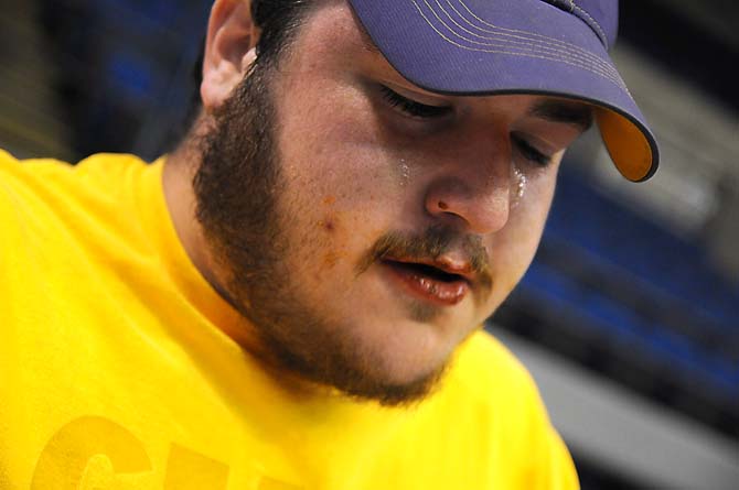 Agricultural education junior Adam Thibodeaux sheds a few tears during a hot wing eating contest Saturday, April 26, 2014 during the first annual Louisiana Wing-a-thon at the Baton Rouge River Center.