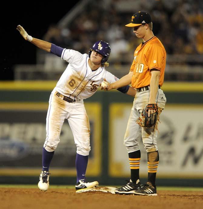 LSU sophomore outfielder Andrew Stevenson (6) singles that he is safe at second on Friday, April 25, 2014 during the Tigers' 8-7 victory against Tennessee at Alex Box Stadium.