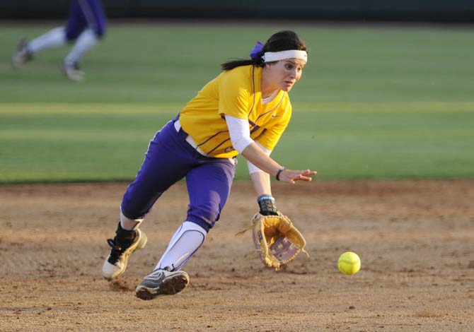 LSU senior infielder Allison Falcon (32) catches the ball Wednesday, April 23, 2014 during the Lady Tigers' 6-1 victory against the University of South Alabama at Tiger Park.