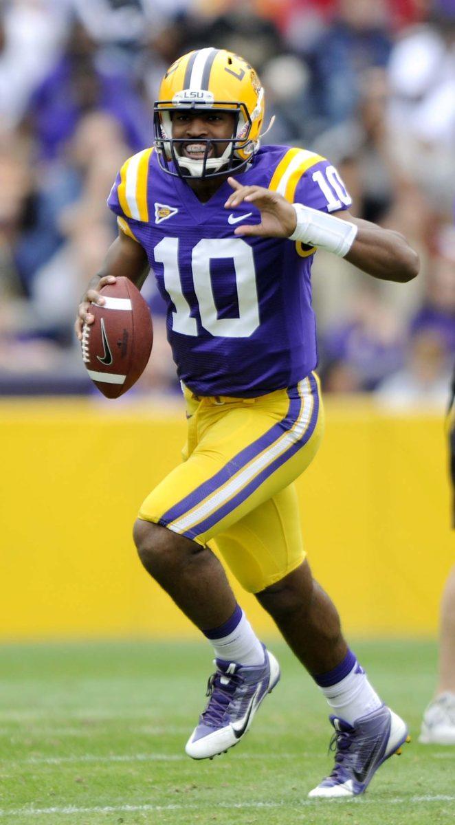 LSU sophomore quarterback Anthony Jennings (10) runs a play Saturday, April 5, 2014 during the white squad's 43-10 victory against the purple squad in the National L Club Spring Game in Tiger Stadium.