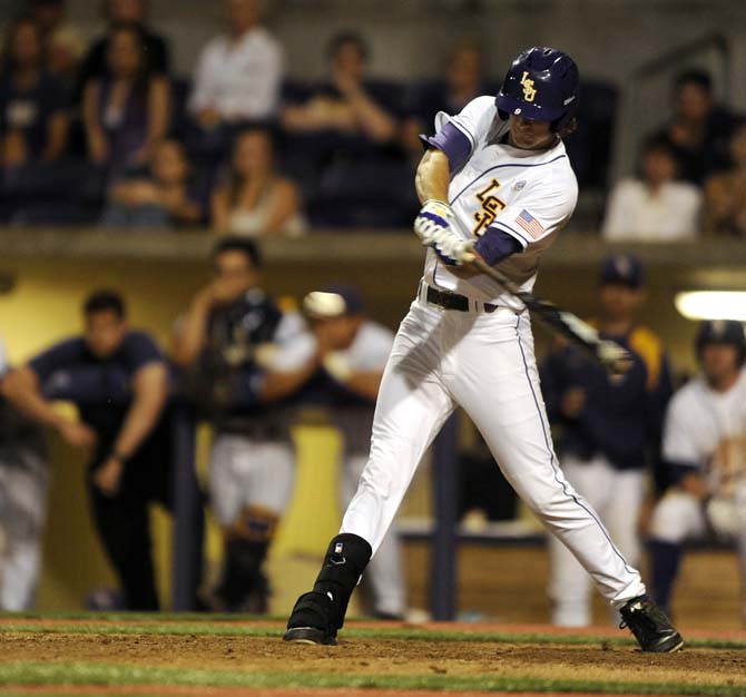 LSU sophomore outfielder Mark Laird hits the walk off single Friday, April 25, 2014 during the Tigers' 8-7 victory against Tennessee at Alex Box Stadium.