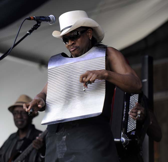 Rockin' Dopsie Jr. plays the washboard Saturday, April 26, 2014, during the New Orleans Jazz and Heritage Festival.