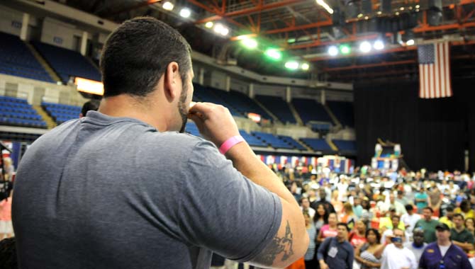 Contestant Brandon Grotsma eats wings in front of a growing crowd during a hot wing eating contest Saturday, April 26, 2014 during the first annual Louisiana Wing-a-thon at the Baton Rouge River Center.