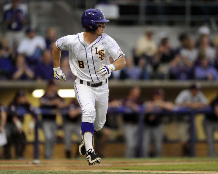 LSU sophomore infielder Alex Bregman (8) runs to first base after a hit during the Tigers' 3-0 victory against Mississippi State on Friday, April 4, 2014 at Alex Box Stadium.