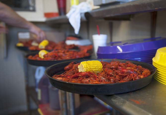 The weighed crawfsh are prepared on platters Thursday, April 12, 2014 at LT's Seafood located in Broussard, La.