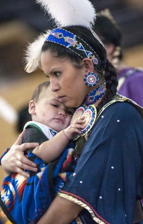 Traci Ashapanek dances with her child Saturday, April 5, 2014 during the 5th Annual LSU Native American Student Organization Spring Pow Wow held in Parker Coliseum.