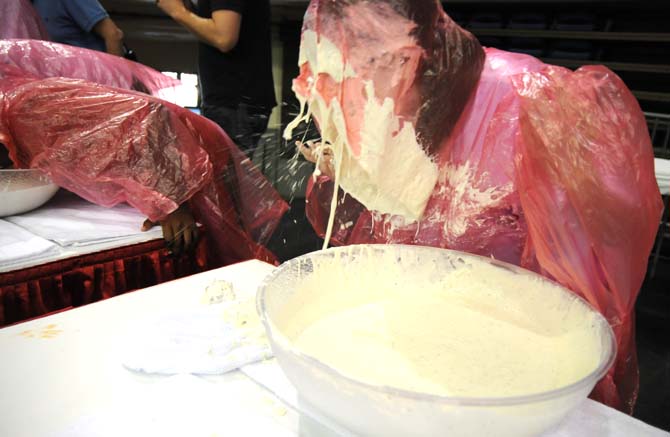 A contestant's face drips with ranch dressing during a bobbing for wings competition Saturday, April 26, 2014 during the first annual Louisiana Wing-a-thon at the Baton Rouge River Center.