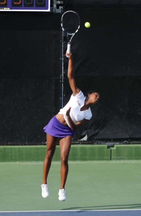 LSU freshman Skylar Holloway serves the ball Friday, March 21, 2014 during a doubles match against Mississippi State at W.T. "Dub" Robinson Stadium.