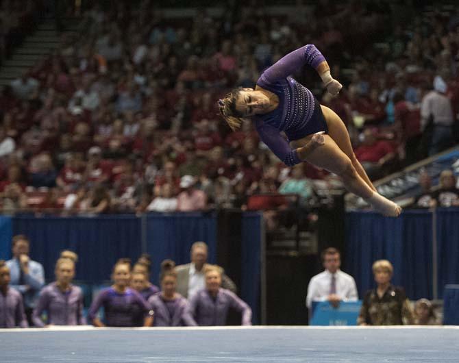 LSU sophomore all-around gymnast Jessica Savona flips during her floor routine Saturday, April 19, 2014 in the fourth rotation of the NCAA Super Six Finals in Birmingham, Ala.