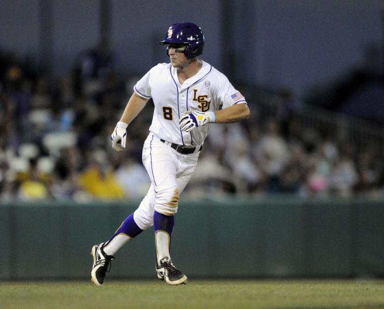 LSU sophomore infielder Alex Bregman (8) tries to steal a base during the Tigers' 3-0 victory against Mississippi State on Friday, April 4, 2014 at Alex Box Stadium.