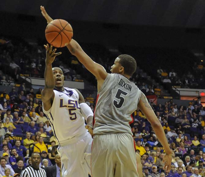 LSU senior forward Shavon Coleman (5) shoots around a defender Saturday, March 8, 2014 during the Tigers' 61-69 loss to Georgia in the PMAC.