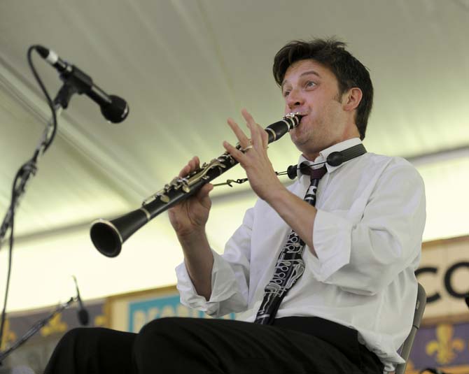 A clarinetist playing with the Shotgun Jazz Band performs a solo Saturday, April 26, 2014, during the New Orleans Jazz and Heritage Festival in New Orleans.