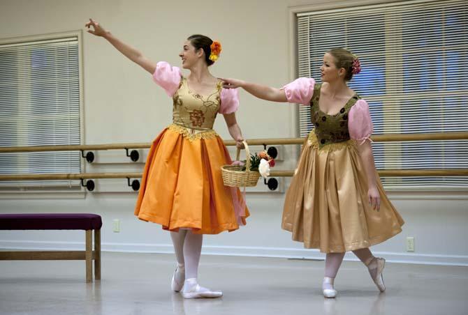 French student Alexis Herrington (right) and biology student Caroline Schulenberg (left) practice scenes from Snow White Tuesday, April 1, 2014, at Baton Rouge Ballet Theatre.