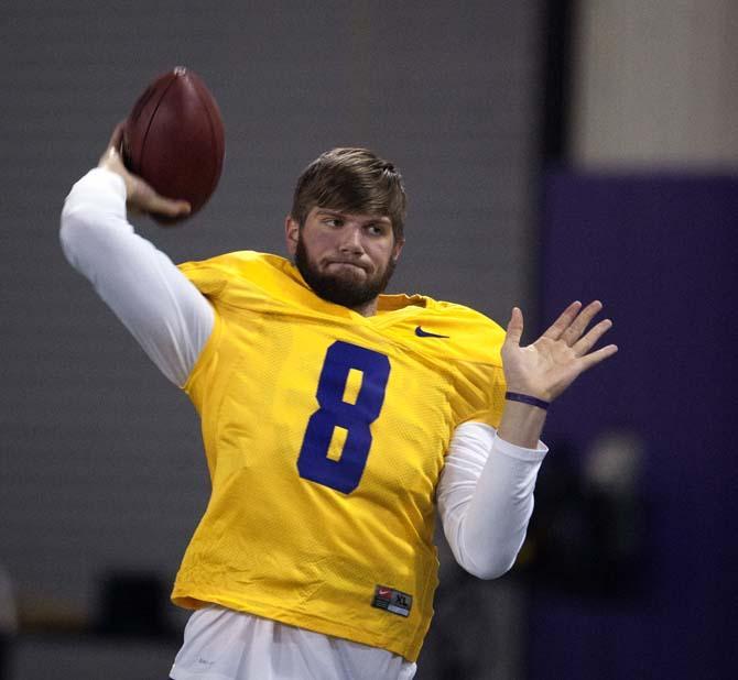 LSU senior quarterback Zach Mettenberger (8) warms up during LSU Pro Day on Wednesday, April 9, 2014 in the LSU Indoor Practice Facility.